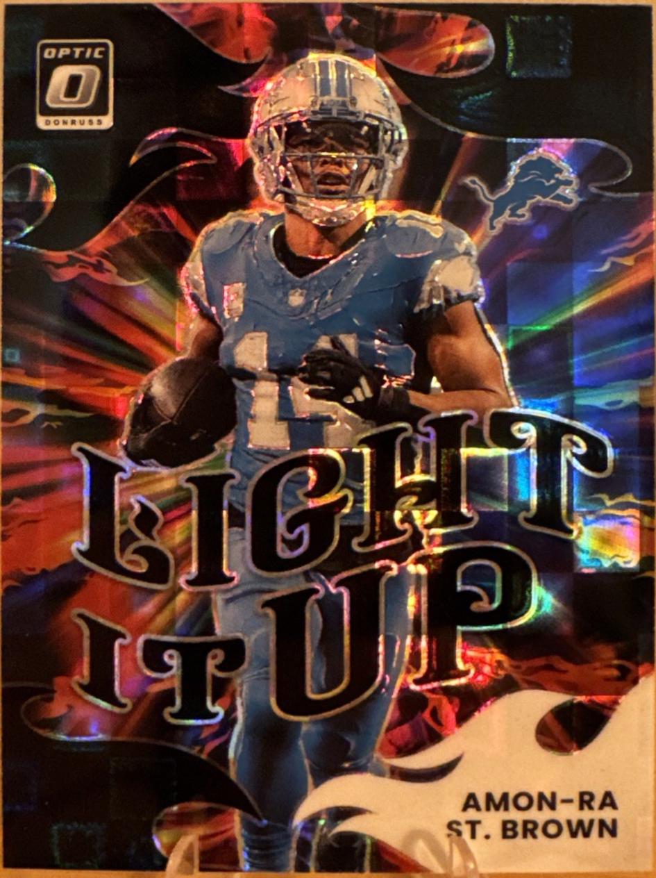 2025 Panini Donruss Optic Light It Up Amon-Ra St. Brown [Black Pandora] #15 card